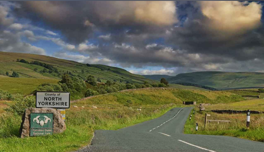 Image of countryside and a sign saying North Yorkshire